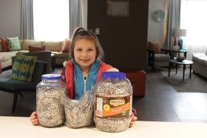 Kenzie collecting pop-tabs